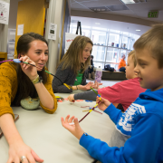 Students affiliated with CU Boulder's Intermountain Neuroimaging Consortium teach elementary school students about the brain