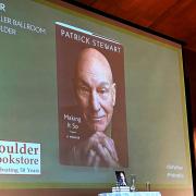 Photo of Patrick Stewart book cover on a screen in the UMC before his book talk