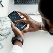 Man looking at stocks on a computer screen.