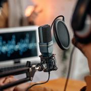 stock image of person recording a podcast