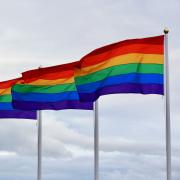 Pride flags blow in the wind
