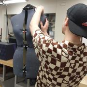 Undergrad works with a mannequin for the project