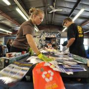 Students sorting recycled materials on campus