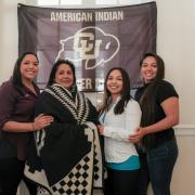 Patrita “Ime” Salazar wears a ceremonial “Los Ojos” wool blanket as she poses with her daughters, left to right, Kalee, Tachara and Cibonet.