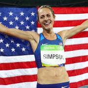 Jenny Simpson holds up American flag after winning bronze medal in Rio Olympics
