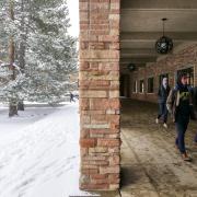 Students walking across snowy campus