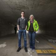 Instructor Martha Russo and student Sam Jones pose for a photo in the Regent underpass