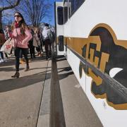 People step off the Buff Bus on the first day back from winter break. Photo by Casey A. Cass.