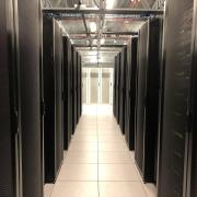 Rows of storage in a room holding computing technology.