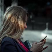 Woman texting on cell phone