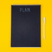 Small chalkboard image with the word "plan." (Unsplash/Volodymyr Hryshchenko)