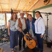 Susan Thomas and Xóchitl Chávez with musicians Sam Medina and Gilbert Medina. 