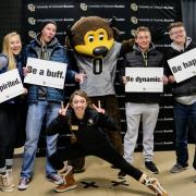 Prospective students pose with Chip the Buffalo. Photo by Glenn Asakawa.