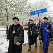 Chancellor DiStefano and faculty walk in commencement procession