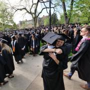 Grads gather at Norlin Quad before the main commencement ceremony. Photo by Glenn Asakawa.