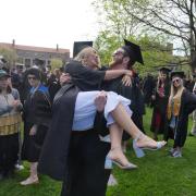 Grads gather at Norlin Quad before the main commencement ceremony. Photo by Glenn Asakawa.