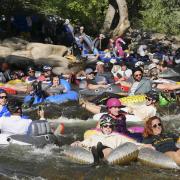 Tubers ride the Boulder Creek for Tube to Work Day 2018