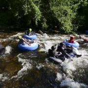 Tubers ride the Boulder Creek for Tube to Work Day 2018