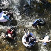 Tubers ride the Boulder Creek for Tube to Work Day 2018