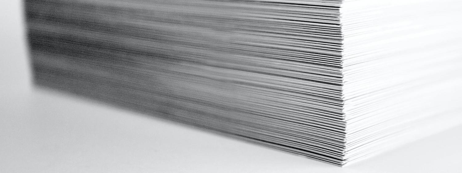 A stack of paper (Photo by ron dyar on Unsplash)