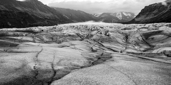 A black-and-white photo of a glacier