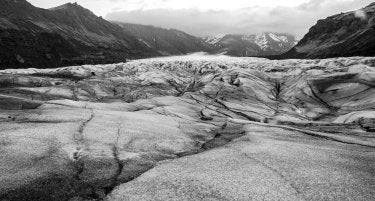 A black-and-white photo of a glacier