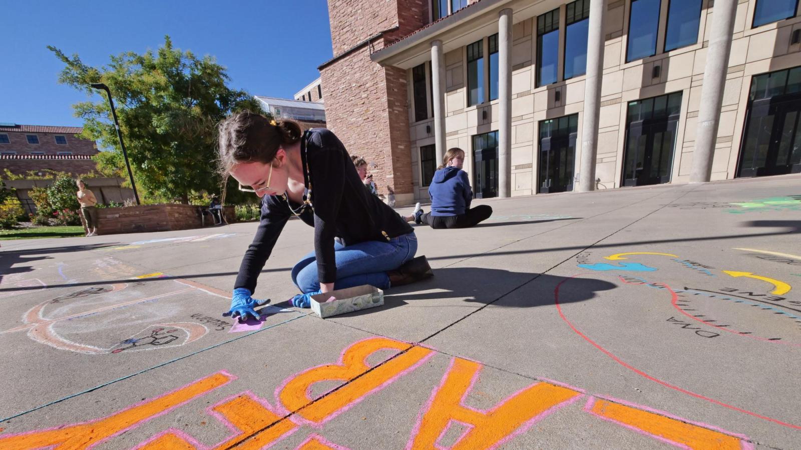 Students creating chalk art