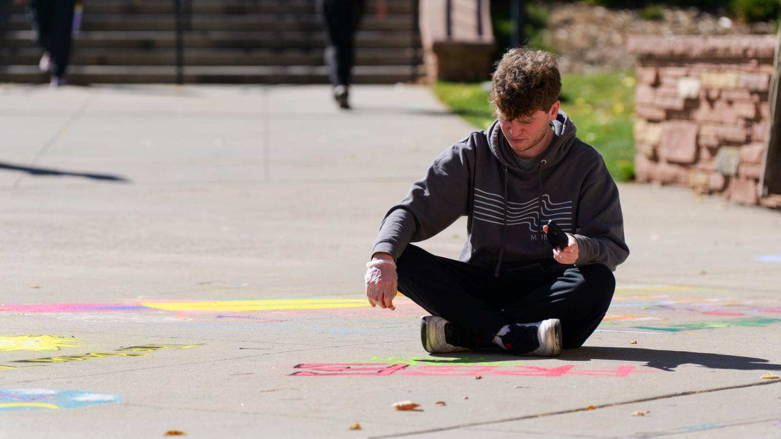 Students creating chalk art