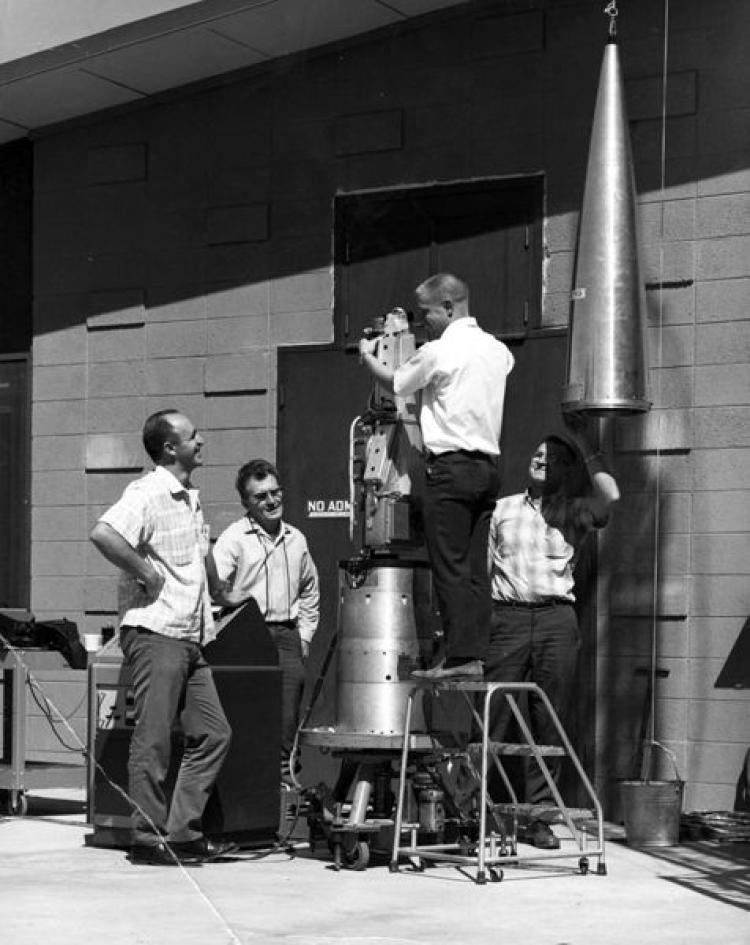 Engineers work on a rocket component